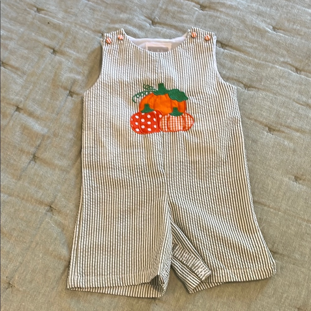 Sage green seersucker romper with pumpkin detail